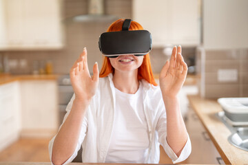 Young Woman Joyfully Experiences Virtual Reality in Cozy Kitchen Setting During Afternoon