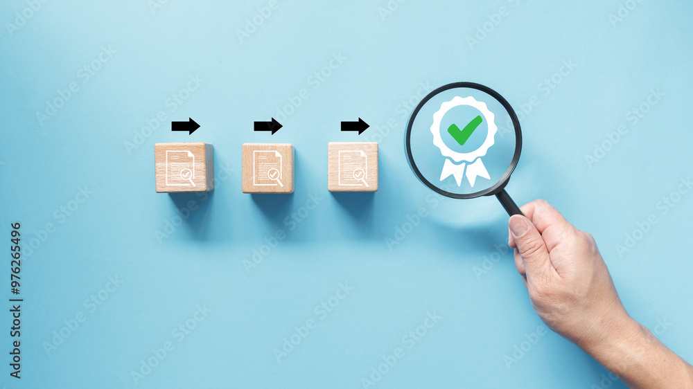Poster hand holding magnifying glass over certificate icon and wooden cube block with document icon. qualit