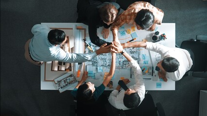 Top view of smart manager clapping hands and putting hands together to celebrate project. Aerial...