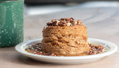Biscuits with pecans pralen. Delicious biscuits, explosion flavors, natural  lighting, studio background, well-lit, vibrant colors, sharp-focus, high-quality, sweets, coffee 