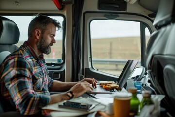 A person working on their computer, ideal for office or remote work scenarios