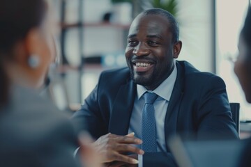Fototapeta premium Man in a suit and tie having a conversation with a woman, possibly discussing business or career goals
