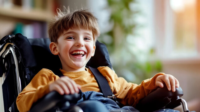 Smiling boy with SP in a wheelchair in the room. World Cerebral Palsy (SP) Day. Disabled child at home. The concept of treatment, education and inclusion of sick children into society