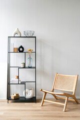 Living room with bookshelf and wooden lounge chair