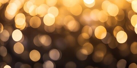 Obraz premium The image showcases a beautiful bokeh effect with golden lights softly glowing, creating a warm and dreamy atmosphere perfect for festive or cozy settings.
