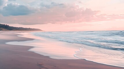 A beautiful beach with soft, pink sand and gentle waves lapping the shore under a pink-hued sky.