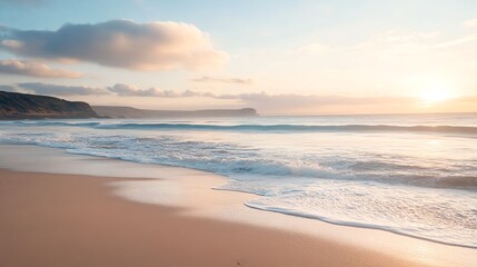 Tranquil beach scene with white sand and foamy waves lapping at the shore.