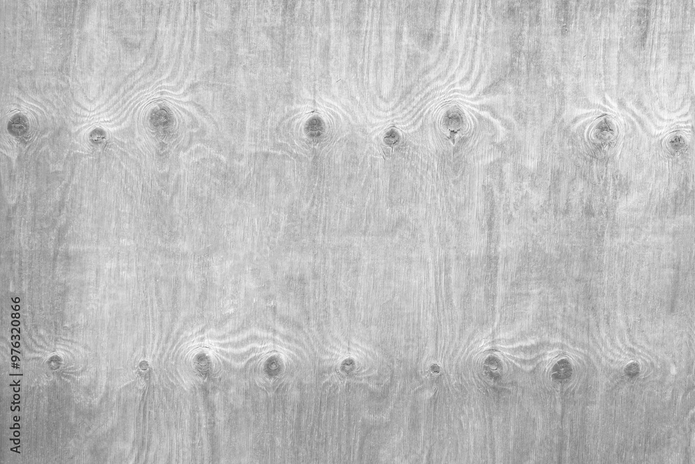 Poster a wooden surface with a grainy texture and a few holes. the surface is mostly white, with some brown