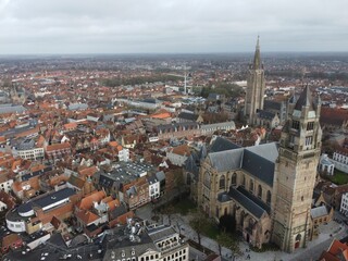 Brugge from an aerial perspective, highlighting its historical charm, architectural beauty, and scenic waterways
