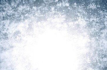 Grunge texture with a frosty blue overlay creates a vintage, weathered background with a transparent center