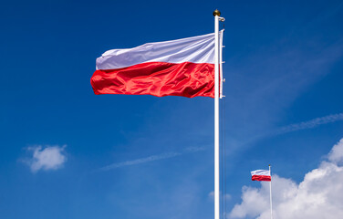 Polish flag against the sky