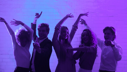 Dance Party. Young Men And Women Having Fun Dancing In Night Club Indoors. Panorama, Blue Light