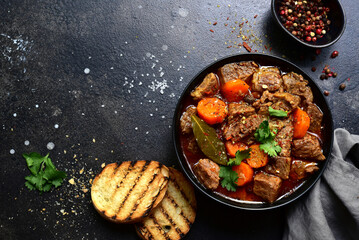 Goulash (meat stew with tomatoes and paprika) - traditional dish of hungarian cuisine.