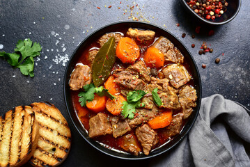 Goulash (meat stew with tomatoes and paprika) - traditional dish of hungarian cuisine.