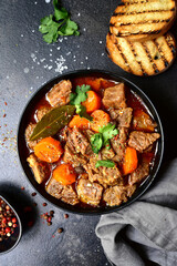 Goulash (meat stew with tomatoes and paprika) - traditional dish of hungarian cuisine.
