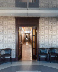a corridor decorated in wood with cabins for passengers on an ancient steamship