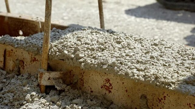 Crafting a Sturdy Foundation With Fresh Wet Mix Concrete on a Sunny Day at a Construction Site