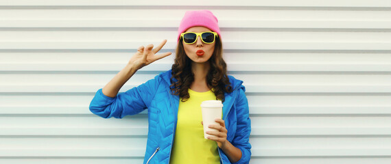 Stylish happy modern young woman in vivid colorful clothing, fashion teenage girl posing on white