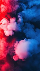 Fototapeta premium Colorful Smoke Clouds Blend in Vibrant Red and Blue Hues Against a Dark Backdrop