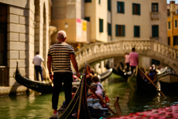 Venice and its buildings,canals,gondolas,and sculptures