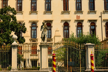 Fototapeta premium Venice and its buildings,canals,gondolas,and sculptures