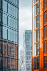 Fototapeta premium Modern urban architecture in a vibrant city under a bright blue sky filled with fluffy clouds