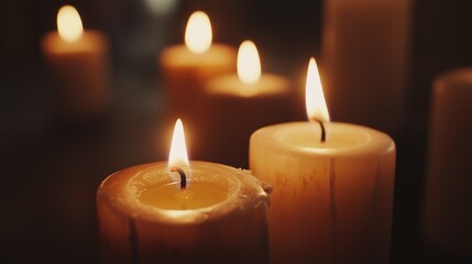 Several candles burning with limited depth of field