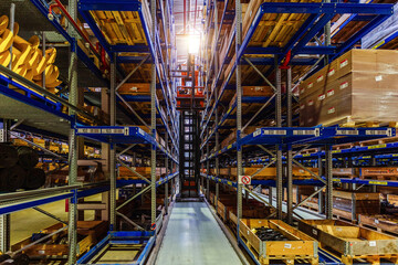 Forklift loader in Modern warehouse interior with shelves and boxes