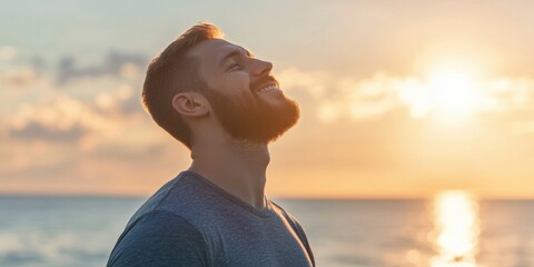 A person is seen standing by the ocean, facing the rising sun with a relaxed and thoughtful demeanor, encapsulating a serene and tranquil morning moment at the beach.