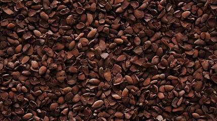 Obraz premium a seamless pattern of a close-up, top-down view of cocoa nibs, filling the entire frame with a focus on the intricate details of the elements