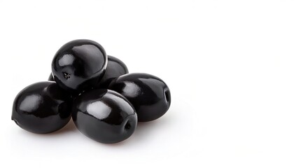 Black olives isolated on a white background with full depth of field and copy space.