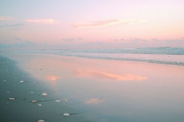 Fototapeta premium Pink Sky Reflecting on Calm Ocean Waves at Dawn