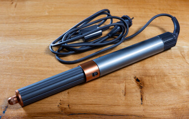 Modern functional hair styling tool designed for effortless, professional-grade curls with long...