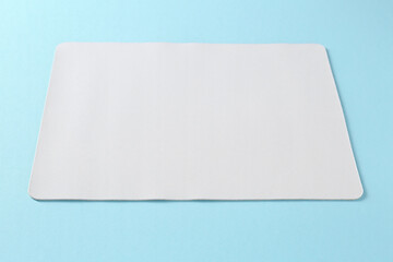One mouse pad on light blue background