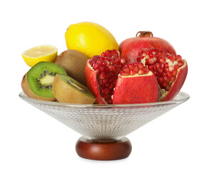 Glass vase with different fresh fruits isolated on white