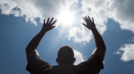 Hands of a man reaching to towards sky