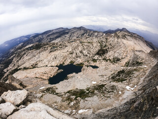 Aerial View of a High Mountain Lake Surrounded by Rugged Terrain