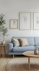 Stylish living room featuring a light blue sofa, elegant decor, and botanical prints, perfect for modern interior inspiration.