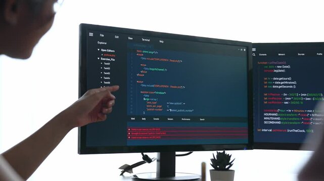 Slow motion back end software developer engineer for computer programming working together on debugging writing computing code, solving complex algorithms display on monitor in office. Burgeoning