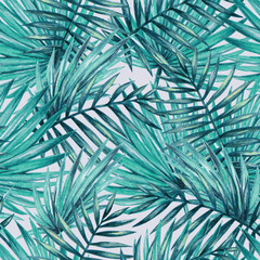 A vibrant pattern of tropical palm leaves in various shades of green, ideal for backgrounds or nature-themed designs.