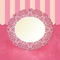 A decorative oval mirror surrounded by intricate lace patterns on a pink background, suitable for design or decor purposes.