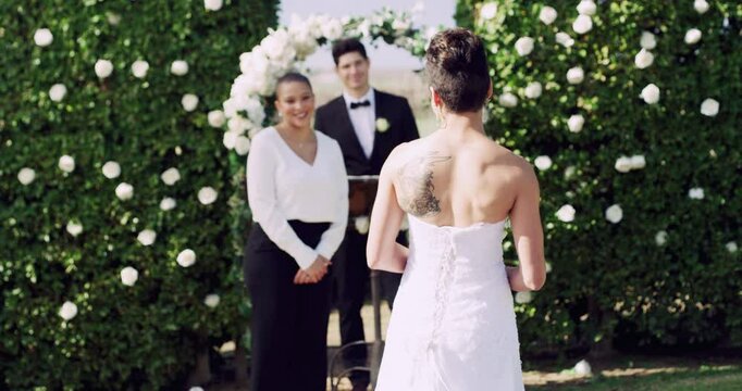 Wedding, lesbian or couple with happy for ceremony, commitment or unity outdoor with minister. Lgbtq, women or queer for marriage, celebration or bride with smile, love and flowers at event in nature