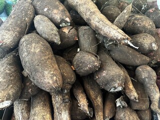 Top view of a group of raw sweet potatoes sale at the groceries market in Malaysia.