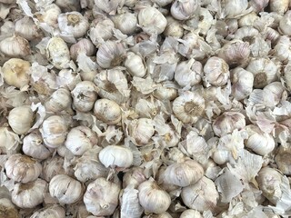 Top view of a group of white garlic sale at the groceries market in Malaysia.