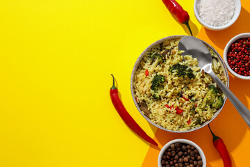 A tart with pilaf, on a yellow background.