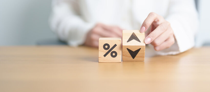 wood block of percentage change to UP and Down arrow. Interest rate, GDP, stocks market, financial, deflation and Inflation, ranking, mortgage, debt, Loan and Economic Recession concept