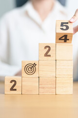 2024 year change to 2025 year block with dartboard icon. Goal, Target, Resolution, strategy, plan,...