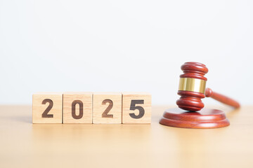 Happy New Year 2025 with judge gavel on table. Law, lawyer, judgment, justice auction and bidding concept