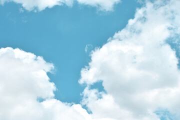 Obraz premium Light blue sky and white clouds. With copy space. 