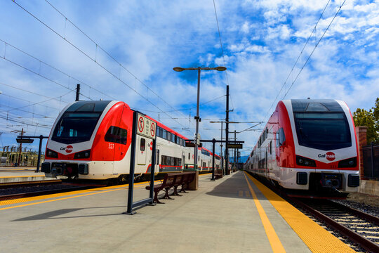 Two double decker electric Caltrain commuter trains Stadler KISS are stationed at a platform - San Jose, California, USA - September 15, 2024